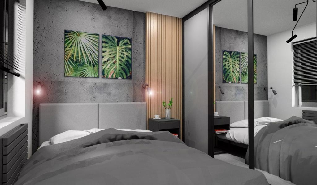 Sypialnia loft, szafa przesuwna z lustrami, łóżko za bezgłowiem szarym, panele na ścianie, beton za łózkiem, plakaty zielone liście